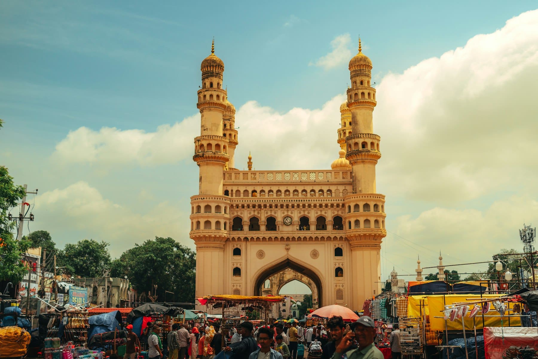 The Charminar monument in Hyderabad under a blue sky